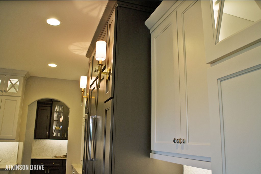 Home-a-Rama 2014: Sconces highlighting a refrigerator with cabinetry panels | Atkinson Drive