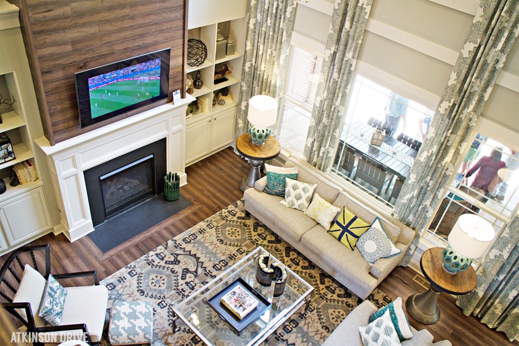 Home-a-Rama 2014: Comfortable family room with wooden fireplace focal wall | Atkinson Drive