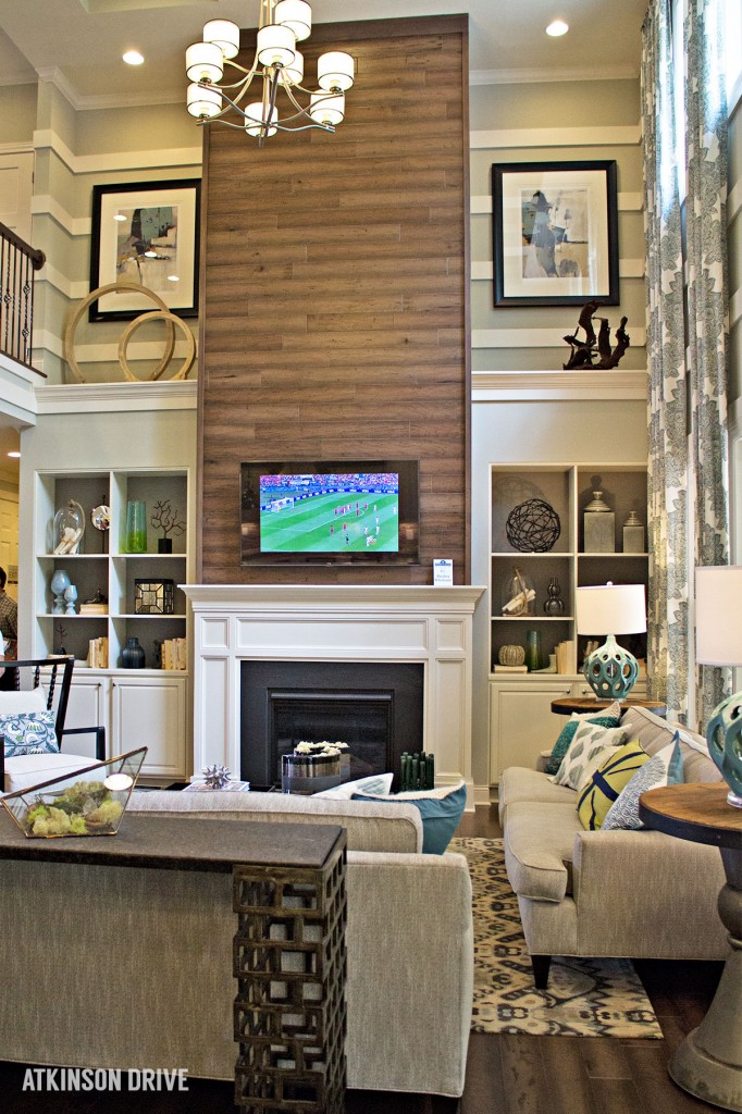 Home-a-Rama 2014: Cozy family room with floor-to-ceiling wood fireplace focal wall  | Atkinson Drive