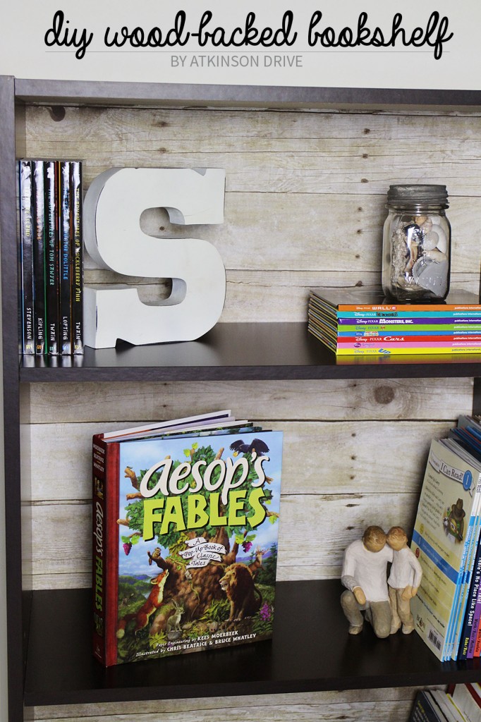 Create a faux wood-backed bookcase with a few simple tools, 5 minutes of your time, and only $10! /// by Atkinson Drive